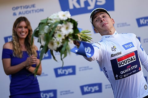 Remco Evenepoel in best young rider's white jersey